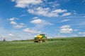 John Deere R4040i sprayer spraying in wheat field Royalty Free Stock Photo