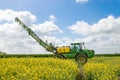 John Deere R4040i sprayer spraying in RSO field Royalty Free Stock Photo