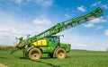 John Deere R4040i sprayer spraying in wheat field Royalty Free Stock Photo