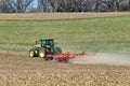 John Deere 8400R tractor pulling a Kuhn Excelerator 8000 tiller