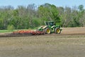 John Deere 9470R tractor pulling a Wil-Rich XL field cultivator