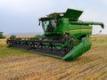 A John Deere S680 combine is parked in a wheat field in Idaho, USA - July 26, 2021 Royalty Free Stock Photo