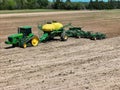 John Deere 8420T tractor pulling a Deere 1910 air cart with a 68 row Deere 1890 air seeder planting soybeans