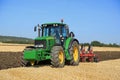 John Deere 6630 Tractor and Agrolux Plow on Field