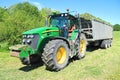 The John Deere 7930 tractor with the dumping Fliegl Gigant ASW 393 semi-trailer