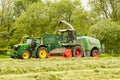 A John Deere tractor with Fendt Katana 65 forager Royalty Free Stock Photo