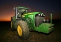 John Deere Tractor in the field in sunset