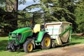 John deere tractor with a grass cutter.