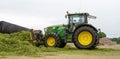 John Deere tractor pushing silage at the clamp