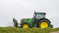 John Deere tractor pushing silage at the clamp