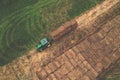 John Deere tractor with straw hay trailer the transporting round bales. Storage hay at farm. Hay Forage feed for beef and dairy