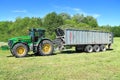 John Deere 7930 tractor with tipper semitrailer Fliegl Gigant ASW 393