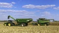 John Deere tractors are harvesting the fall corn crop Royalty Free Stock Photo