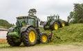 John Deere tractors pushing silage at the clamp