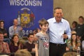 John Kasich embracing a young supporter