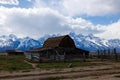 The John Moulton barn with the snow covered Teton Mountains in the background in Jackson Hole Royalty Free Stock Photo