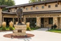 John Wayne sculpture in front of the John Wayne Birthplace Museum