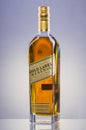 Johnnie Walker Gold Label blended whisky on gradient background