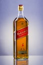 Johnnie Walker Red Label blended whisky on gradient background.