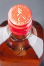 Johnnie Walker red rye finish blended whisky on stone slate background.