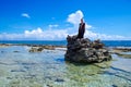 JOHNNY CAY, COLOMBIA - OCTOBER 21, 2017: Unidentified blonde woman enjoying the beautiful sunny day over a rock in the