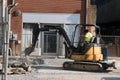 Street maintenance with a backhoe in downtown