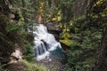 Johnston canyon waterfall flowing in deep forest at Banff national park