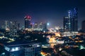 Johor Bahru, Malaysia, at night. Malaysian city with traffic on highway and modern business buildings and hotels in downtown. Royalty Free Stock Photo