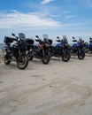 Super Tenere motorcycles  parking together on the beach sand Royalty Free Stock Photo