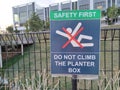 Safety First Sign to the public regarding Do Not Climb The Planter Box.