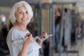 Joiful pretty delighted woman exercising with barbell.