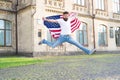 Join celebration. Patriotic guy expressing happiness in street. Patriotic spirit. Patriotic man jumping with american