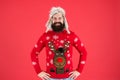 Join holiday party craze and host Ugly Christmas Sweater Party. Sweater with deer. Hipster bearded man wear winter