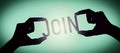 Join - human hands holding black silhouette word Royalty Free Stock Photo