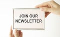 JOIN OUR NEWSLETTER text on notepad