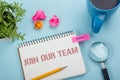 Join our team. Office desk table with notepad, pencil and coffee cup. Top view. Royalty Free Stock Photo