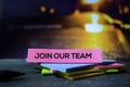 Join Our Team on the sticky notes with bokeh background Royalty Free Stock Photo