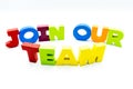 Join Our Team text written with colourful wooden letters, over white with copy space Royalty Free Stock Photo