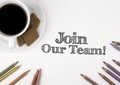 Join our team! White desk with a pencil and a cup of coffee. Royalty Free Stock Photo