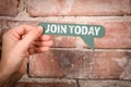 Join Today. Green speech bubble with text on a red brick background Royalty Free Stock Photo