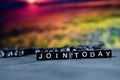 Join today on wooden blocks. Cross processed image with bokeh background Royalty Free Stock Photo