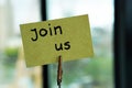 Join us written on a memo Royalty Free Stock Photo