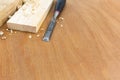 Joiner chisel with boards and shavings Royalty Free Stock Photo