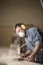 Joiner labouring in mask Royalty Free Stock Photo