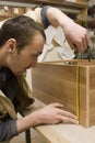 Joiner making furniture in his manufactory Royalty Free Stock Photo