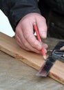 Joiner marking up timber Royalty Free Stock Photo