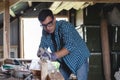 Joiner planes wood hand planing machine in the home workshop.Private entrepreneur working at his workplace