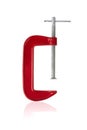 Red clamp on a white background. Joiner`s clamp close-up Royalty Free Stock Photo