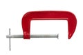 Red clamp on a white background. Joiner`s clamp close-up Royalty Free Stock Photo