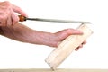 Joiner working on a piece of wood with a file Royalty Free Stock Photo